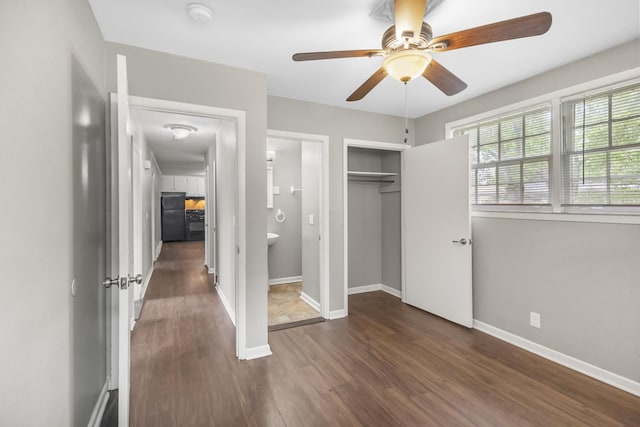 1903 Fern Dr Unit 1903-1905, Murfreesboro, TN 37130 - unfurnished bedroom featuring freestanding refrigerator, dark wood-style flooring, a closet, baseboards, and a ceiling fan