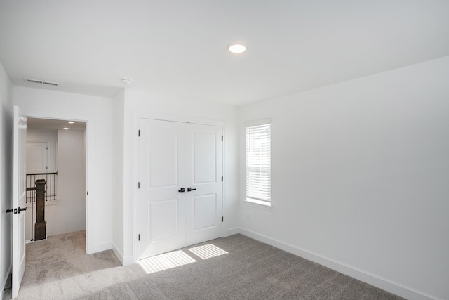 124 W Cassa Way, Mount Juliet, TN 37122 - unfurnished bedroom with carpet, a closet, baseboards, and recessed lighting