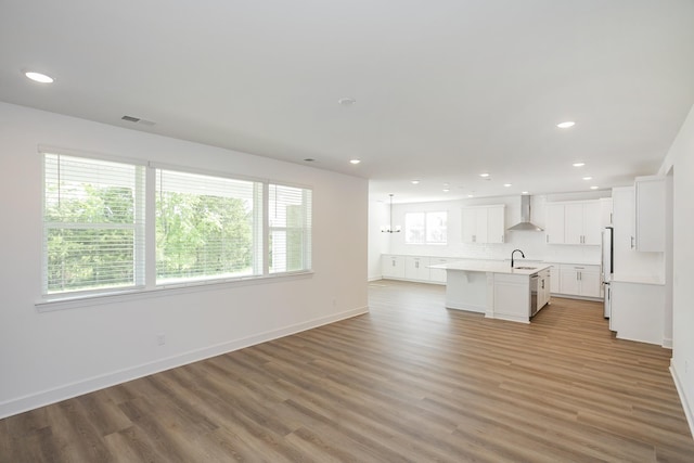 124 W Cassa Way, Mount Juliet, TN 37122 - unfurnished living room with a sink, healthy amount of natural light, light wood-style flooring, recessed lighting, and baseboards