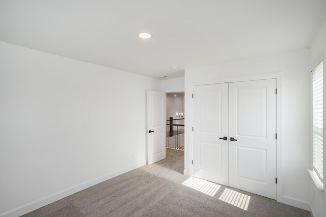 124 W Cassa Way, Mount Juliet, TN 37122 - unfurnished bedroom with light carpet, baseboards, a closet, and recessed lighting