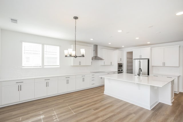 124 W Cassa Way, Mount Juliet, TN 37122 - kitchen with wall chimney exhaust hood, appliances with stainless steel finishes, a sink, backsplash, and recessed lighting