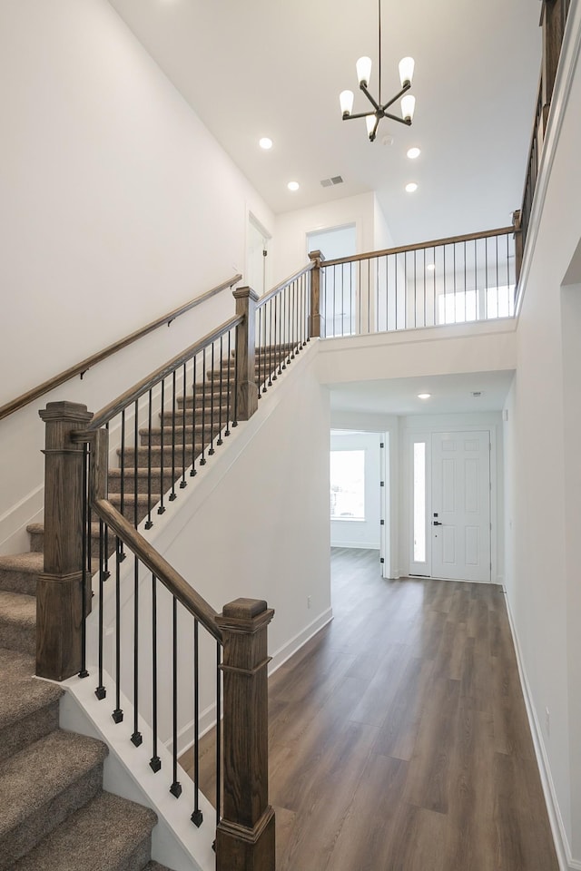 124 W Cassa Way, Mount Juliet, TN 37122 - staircase featuring wood finished floors, a chandelier, a high ceiling, recessed lighting, and baseboards