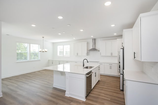 124 W Cassa Way, Mount Juliet, TN 37122 - kitchen with wall chimney range hood, appliances with stainless steel finishes, a sink, backsplash, and recessed lighting