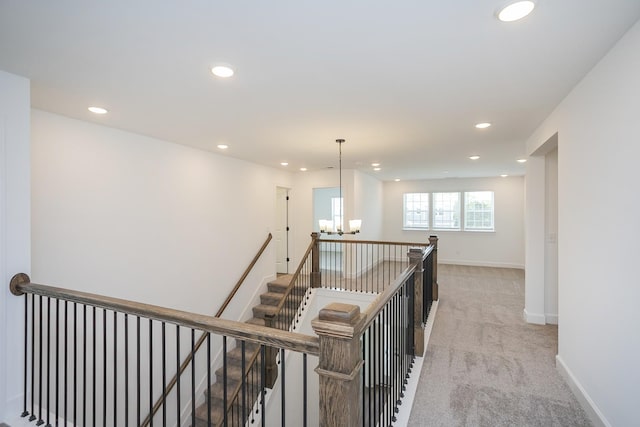 124 W Cassa Way, Mount Juliet, TN 37122 - corridor featuring an upstairs landing, a chandelier, recessed lighting, light carpet, and baseboards