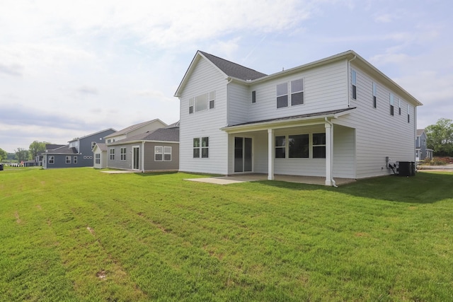 124 W Cassa Way, Mount Juliet, TN 37122 - rear view of property with a patio area, a lawn, and central AC