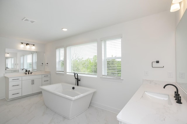 124 W Cassa Way, Mount Juliet, TN 37122 - bathroom featuring two vanities, a soaking tub, marble finish flooring, baseboards, and recessed lighting