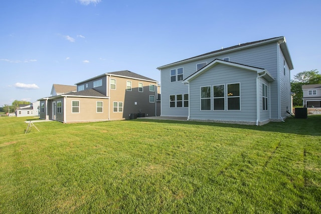 128 W Cassa Way, Mount Juliet, TN 37122 - rear view of property featuring a lawn and central AC