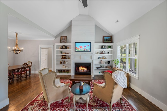7112 Pepper Tree Cir, Fairview, TN 37062 - living area with dark wood-style floors, lofted ceiling, a large fireplace, a chandelier, and baseboards