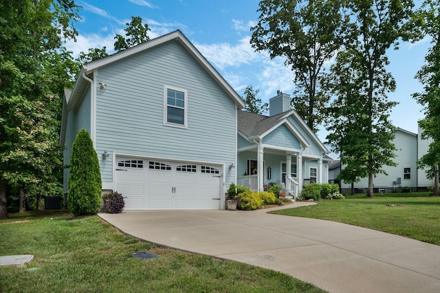 7112 Pepper Tree Cir, Fairview, TN 37062 - view of front of property with a garage, covered porch, a chimney, a front yard, and driveway