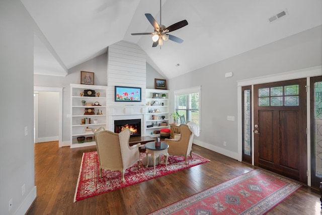 7112 Pepper Tree Cir, Fairview, TN 37062 - living room featuring ceiling fan, baseboards, a large fireplace, wood finished floors, and built in shelves