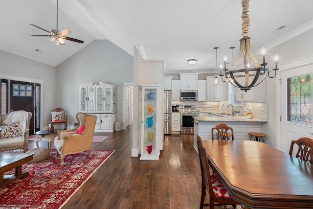 7112 Pepper Tree Cir, Fairview, TN 37062 - dining area featuring a chandelier, a ceiling fan, dark wood-style floors, and lofted ceiling