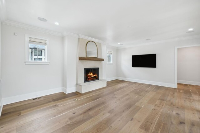 304 Berry Cir, Franklin, TN 37064 - unfurnished living room with a fireplace, light wood-type flooring, crown molding, baseboards, and recessed lighting