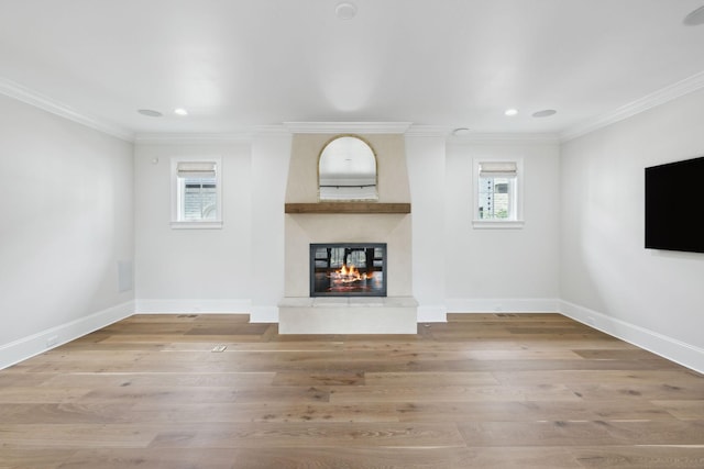 304 Berry Cir, Franklin, TN 37064 - unfurnished living room featuring ornamental molding, a large fireplace, light wood-style floors, baseboards, and recessed lighting