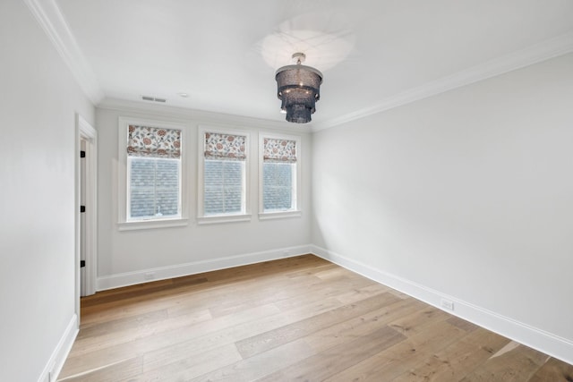 304 Berry Cir, Franklin, TN 37064 - empty room featuring ornamental molding, a chandelier, light wood-style floors, and baseboards
