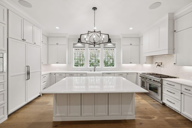 304 Berry Cir, Franklin, TN 37064 - kitchen with double oven range, a sink, a chandelier, a kitchen island, and tasteful backsplash