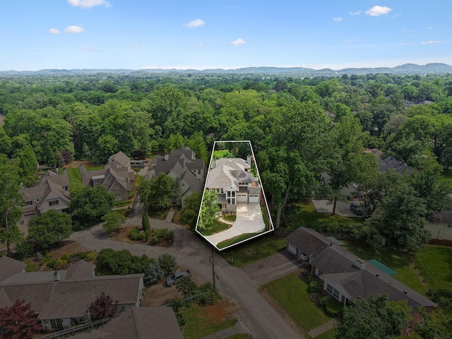 304 Berry Cir, Franklin, TN 37064 - aerial perspective of suburban area featuring property parcel outlined, a heavily wooded area, and a mountainous background