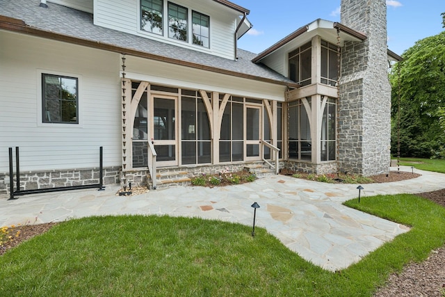 304 Berry Cir, Franklin, TN 37064 - rear view of property with a chimney, a sunroom, a shingled roof, and a patio area