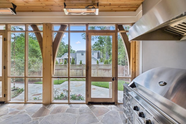 304 Berry Cir, Franklin, TN 37064 - doorway to outside featuring wood ceiling, stone floors, and healthy amount of natural light