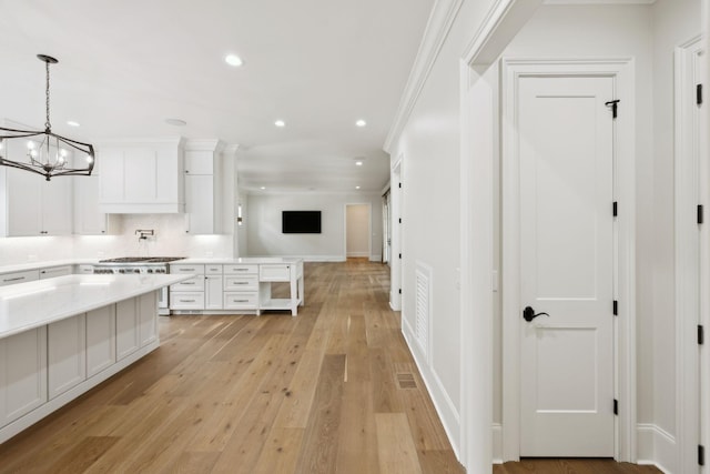 304 Berry Cir, Franklin, TN 37064 - kitchen with a chandelier, white cabinets, recessed lighting, open floor plan, and light wood-style floors
