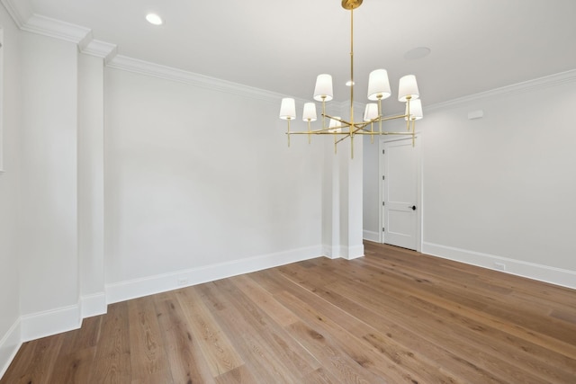 304 Berry Cir, Franklin, TN 37064 - unfurnished room with a chandelier, wood finished floors, baseboards, crown molding, and recessed lighting