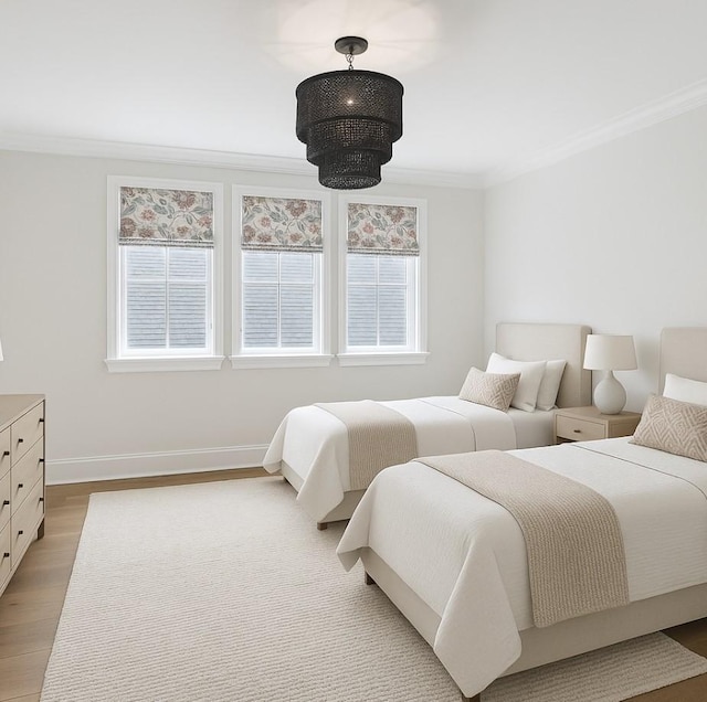 304 Berry Cir, Franklin, TN 37064 - bedroom featuring ornamental molding, light wood-style flooring, and baseboards