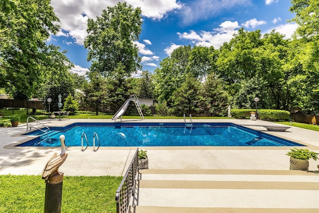 116 Jackson Ln, Hendersonville, TN 37075 - view of swimming pool featuring a water slide, a patio area, a diving board, and view of scattered trees