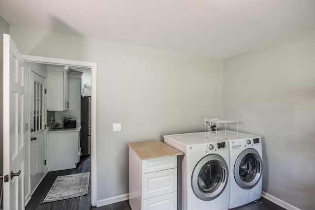 116 Jackson Ln, Hendersonville, TN 37075 - laundry area with separate washer and dryer, baseboards, dark wood finished floors, and cabinet space