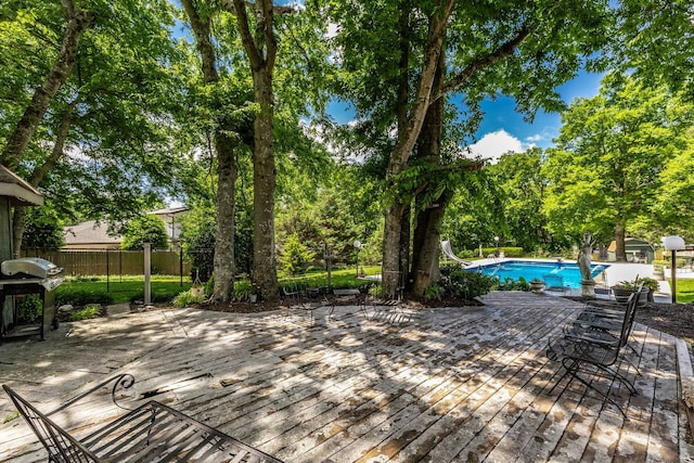 116 Jackson Ln, Hendersonville, TN 37075 - deck with an outdoor pool, view of wooded area, and a grill