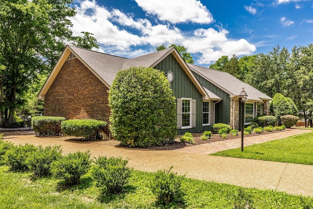 116 Jackson Ln, Hendersonville, TN 37075 - view of home's exterior with board and batten siding and roof with shingles