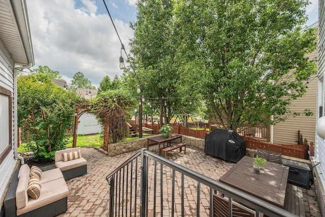 1119 Hudson Ln, Franklin, TN 37067 - fenced backyard with a patio, outdoor dining space, outdoor lounge area, and area for grilling