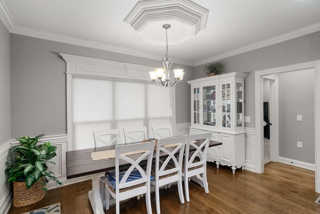 117 Brixton Rdg, Lebanon, TN 37087 - dining area with a chandelier, crown molding, dark wood-style floors, and wainscoting