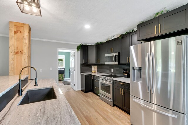 1800 Old Highway 52, Lafayette, TN 37083 - kitchen featuring appliances with stainless steel finishes, a sink, light stone countertops, crown molding, and decorative backsplash