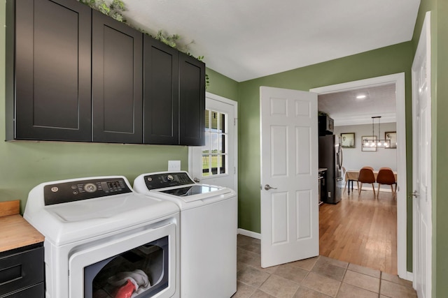 1800 Old Highway 52, Lafayette, TN 37083 - washroom featuring cabinet space, washer and clothes dryer, a chandelier, baseboards, and light tile patterned flooring