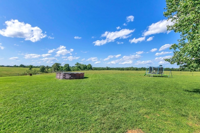 1800 Old Highway 52, Lafayette, TN 37083 - view of green lawn with a trampoline, a view of rural / pastoral area, and an outdoor pool