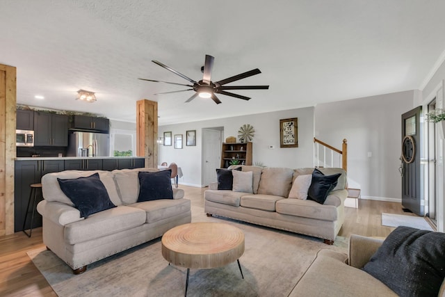 1800 Old Highway 52, Lafayette, TN 37083 - living room featuring light wood-style flooring, a ceiling fan, and baseboards