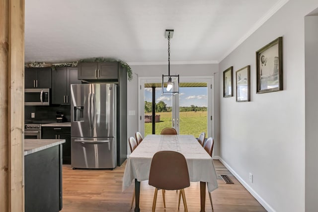 1800 Old Highway 52, Lafayette, TN 37083 - dining room featuring crown molding, light wood finished floors, and baseboards