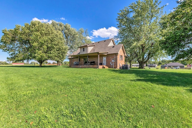 1800 Old Highway 52, Lafayette, TN 37083 - back of house featuring a lawn and brick siding