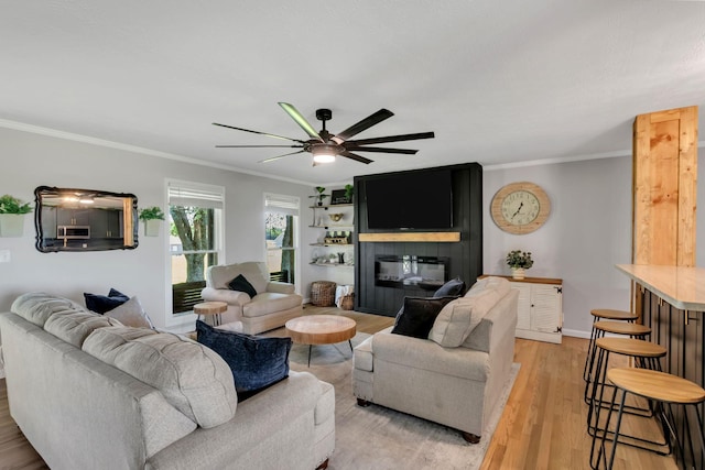 1800 Old Highway 52, Lafayette, TN 37083 - living area with ornamental molding, ceiling fan, a large fireplace, light wood-style floors, and baseboards