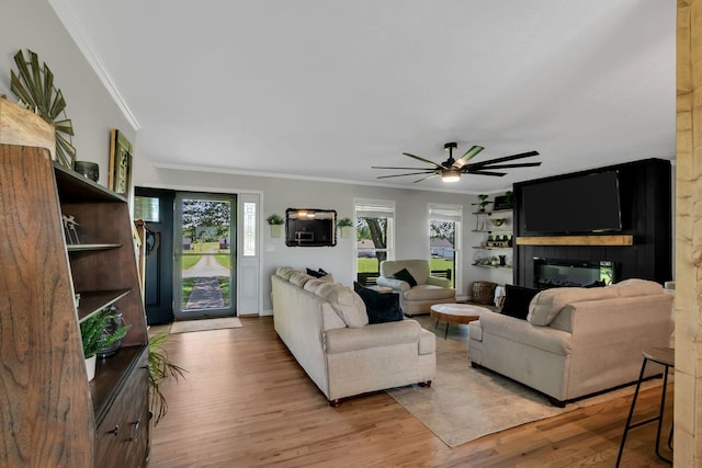 1800 Old Highway 52, Lafayette, TN 37083 - living area with ornamental molding, light wood-style flooring, and a ceiling fan