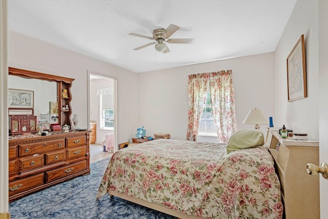 300 Troy Ln, Hohenwald, TN 38462 - bedroom with multiple windows, carpet floors, a ceiling fan, and ensuite bath