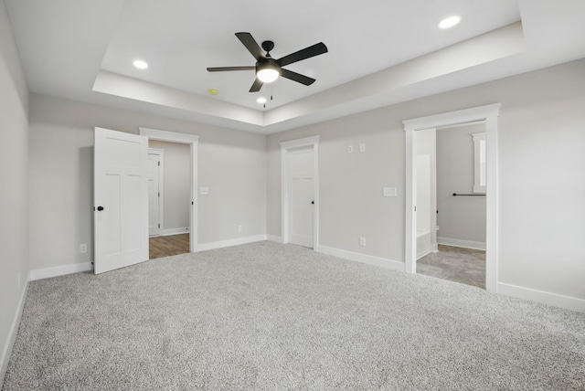 1917 Lewter Dr, Clarksville, TN 37042 - unfurnished bedroom featuring a tray ceiling, carpet flooring, baseboards, and recessed lighting