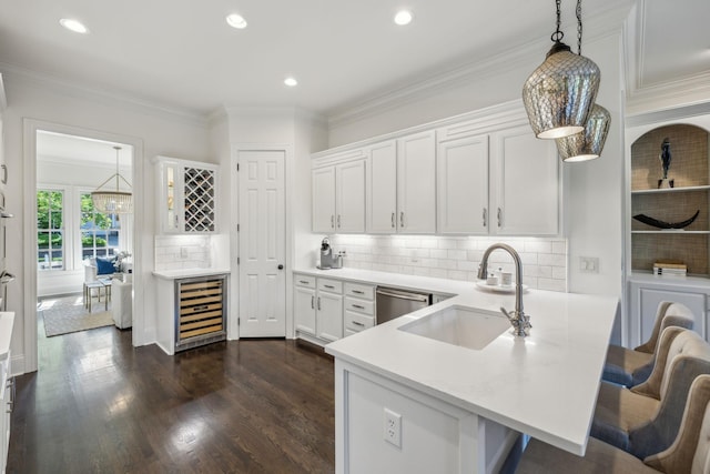 424 Wild Elm St, Franklin, TN 37064 - kitchen featuring wine cooler, a sink, dishwasher, white cabinets, and a peninsula