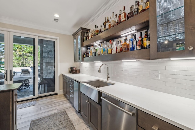 424 Wild Elm St, Franklin, TN 37064 - indoor wet bar with dishwasher, crown molding, and backsplash