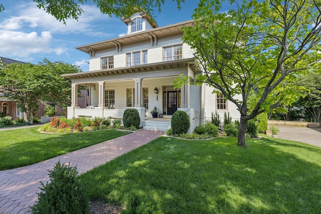 424 Wild Elm St, Franklin, TN 37064 - italianate-style house with covered porch, a front yard, and brick siding