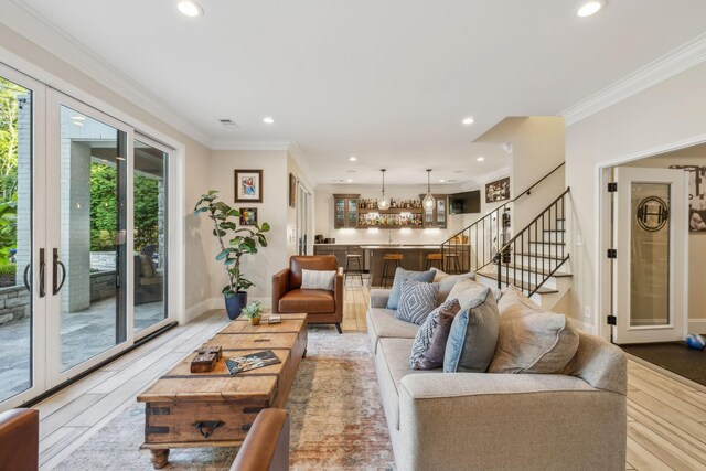 424 Wild Elm St, Franklin, TN 37064 - living area with a chandelier, stairway, crown molding, recessed lighting, and light wood-style flooring