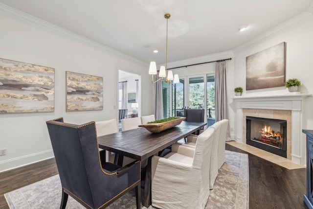 424 Wild Elm St, Franklin, TN 37064 - dining room with a fireplace, ornamental molding, a chandelier, wood finished floors, and recessed lighting