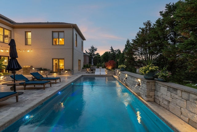 424 Wild Elm St, Franklin, TN 37064 - pool at dusk with a patio and an outdoor pool
