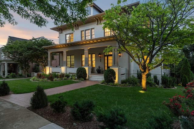 424 Wild Elm St, Franklin, TN 37064 - italianate house featuring covered porch, brick siding, and a yard