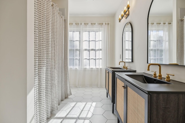 424 Wild Elm St, Franklin, TN 37064 - kitchen featuring a sink, dark countertops, and light tile patterned flooring