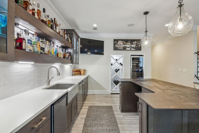 424 Wild Elm St, Franklin, TN 37064 - indoor wet bar with wine cooler, backsplash, ornamental molding, dishwasher, and pendant lighting
